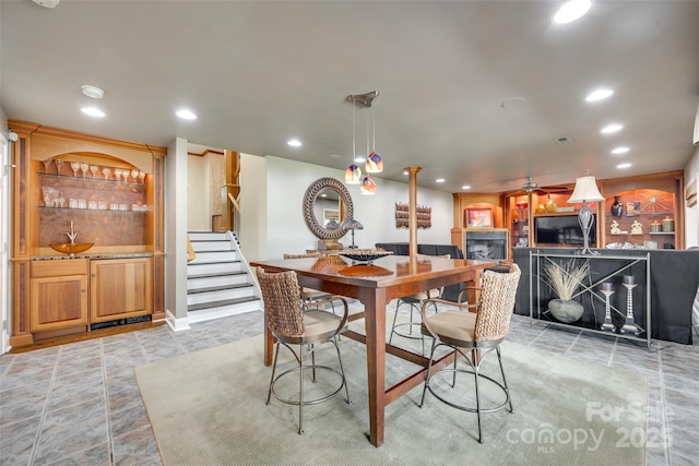 16317 Terry Ln, Huntersville, NC 28078 - dining area featuring visible vents, stairway, recessed lighting, bar, and a ceiling fan