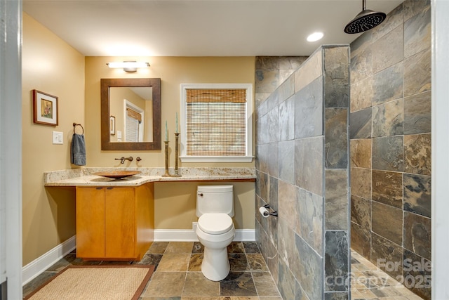 16317 Terry Ln, Huntersville, NC 28078 - bathroom with vanity, a walk in shower, baseboards, and toilet