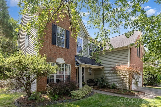 815 Clearbrook Rd, Matthews, NC 28105 - traditional home with brick siding, a garage, and a shingled roof