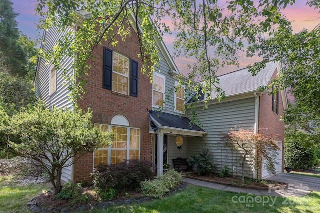 815 Clearbrook Rd, Matthews, NC 28105 - traditional-style house with a shingled roof, an attached garage, and brick siding