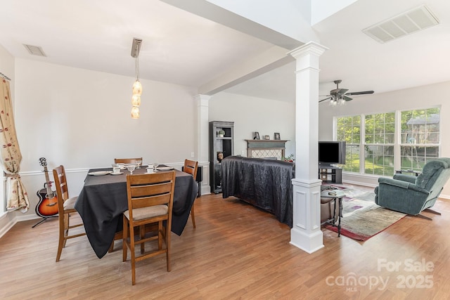 815 Clearbrook Rd, Matthews, NC 28105 - dining area featuring ornate columns, ceiling fan, visible vents, and light wood-style flooring