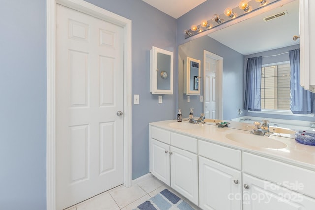815 Clearbrook Rd, Matthews, NC 28105 - bathroom featuring a sink, tile patterned floors, double vanity, and visible vents