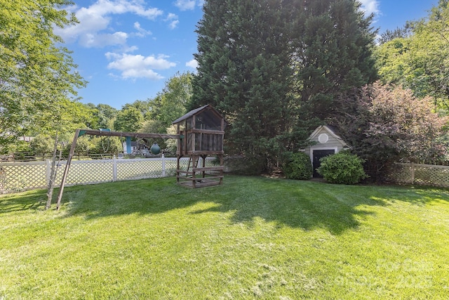 815 Clearbrook Rd, Matthews, NC 28105 - view of yard with a storage shed, fence, and an outbuilding