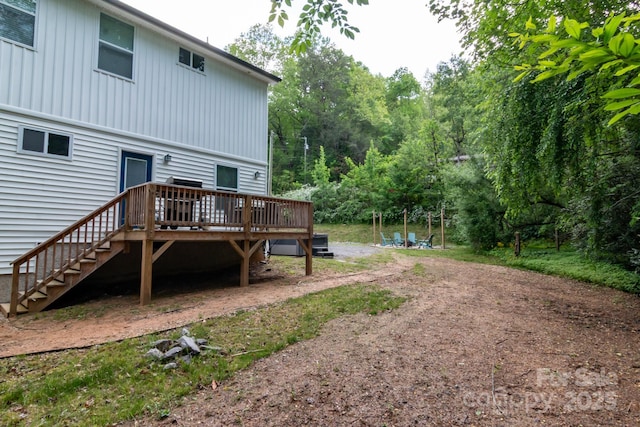 106 Dalton St, Black Mountain, NC 28711 - rear view of property featuring a wooden deck, stairs, and board and batten siding
