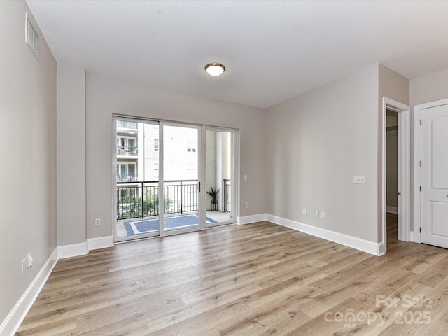 4625 Piedmont Row Dr Unit 410, Charlotte, NC 28210 - empty room with light wood finished floors and baseboards