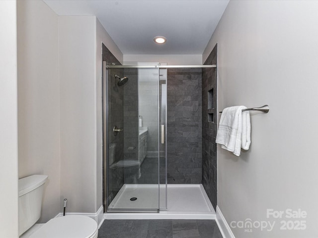 4625 Piedmont Row Dr Unit 410, Charlotte, NC 28210 - bathroom with toilet, baseboards, a shower stall, tile patterned flooring, and recessed lighting
