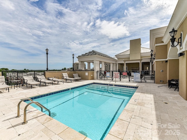 4625 Piedmont Row Dr Unit 410, Charlotte, NC 28210 - community pool featuring a patio area