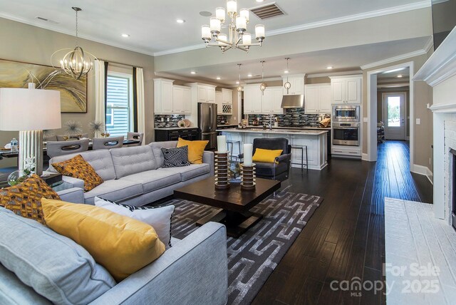 5059 Valita Rd, York, SC 29745 - living room featuring an inviting chandelier, recessed lighting, dark wood finished floors, and visible vents