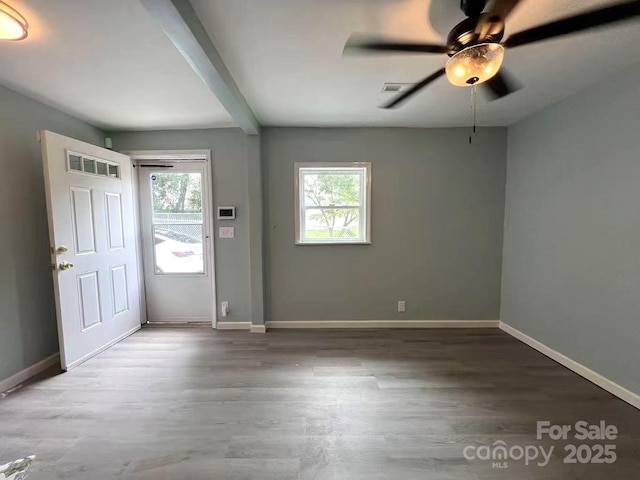entryway with a ceiling fan, baseboards, visible vents, and wood finished floors