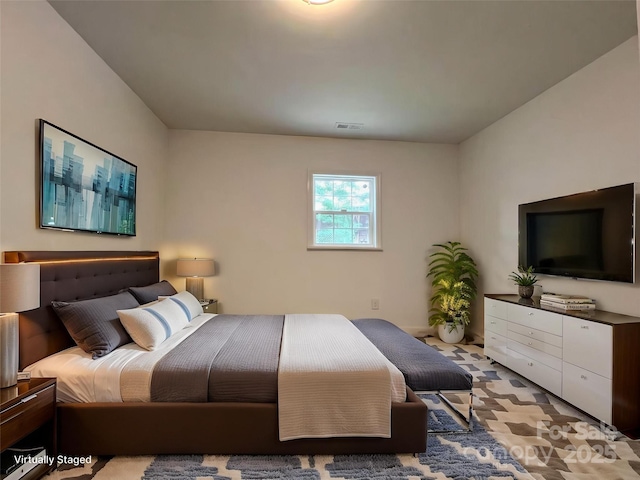 bedroom featuring visible vents