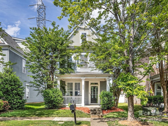 6909 Dunton St, Huntersville, NC 28078 - view of front facade with covered porch and a front lawn