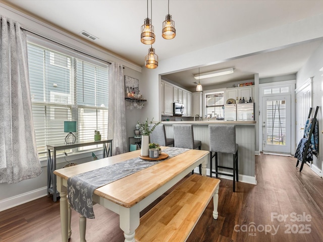 6909 Dunton St, Huntersville, NC 28078 - dining area with visible vents, baseboards, plenty of natural light, and dark wood-style floors