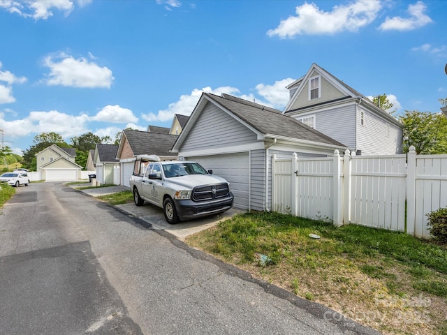 6909 Dunton St, Huntersville, NC 28078 - view of property exterior featuring fence and a garage
