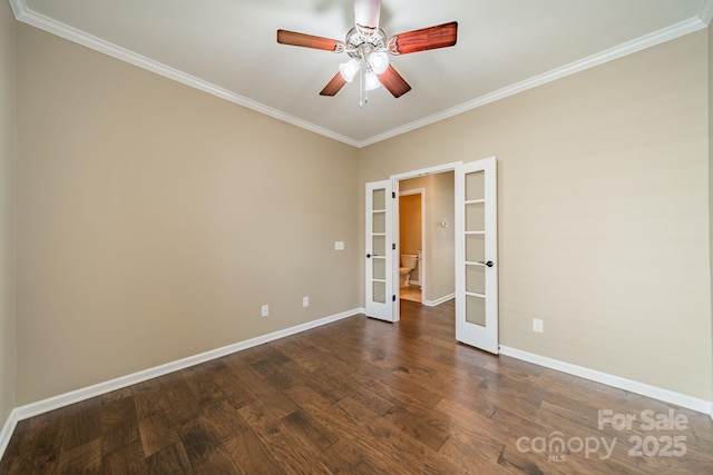 spare room with ceiling fan, french doors, crown molding, baseboards, and dark wood-type flooring