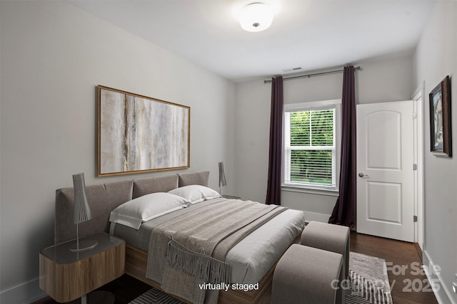 1209 Leigh Ave, Charlotte, NC 28205 - bedroom featuring dark wood-style floors and baseboards