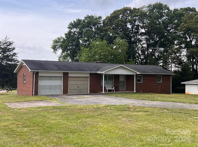ranch-style home with an attached garage, a front yard, brick siding, and concrete driveway