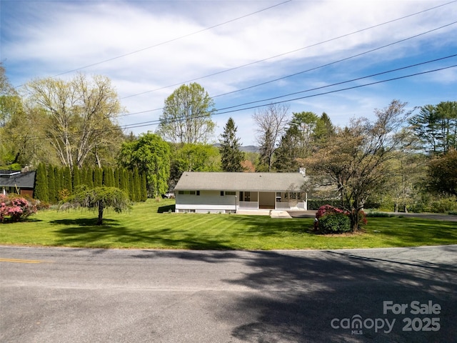 196 Woodland Ter, Brevard, NC 28712 - ranch-style house featuring a porch and a front yard
