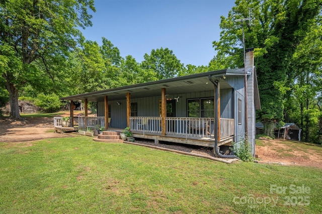 1533 Mcrary Creek Rd, Lenoir, NC 28645 - view of front of house with a porch, a front lawn, and a chimney