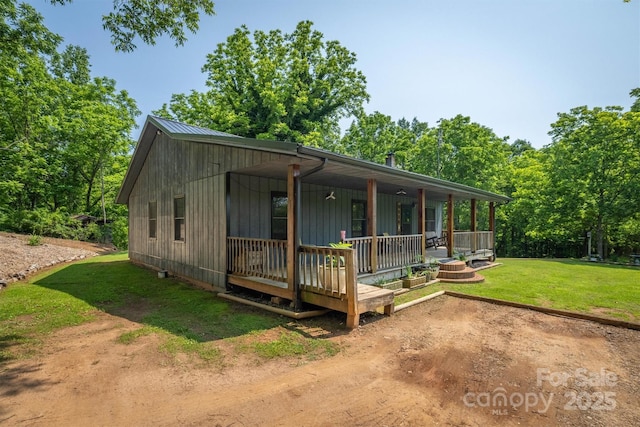 1533 Mcrary Creek Rd, Lenoir, NC 28645 - view of front of house featuring a porch, a front lawn, and metal roof