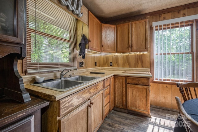 1533 Mcrary Creek Rd, Lenoir, NC 28645 - kitchen with a sink, plenty of natural light, brown cabinets, wooden walls, and light countertops