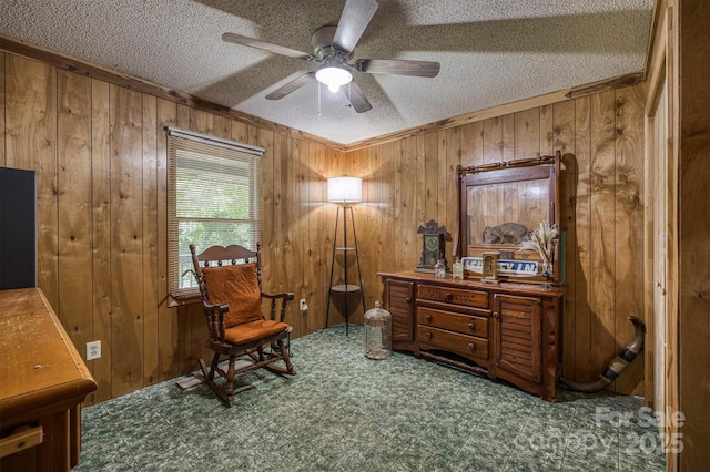 1533 Mcrary Creek Rd, Lenoir, NC 28645 - living area with wooden walls, tile patterned floors, ceiling fan, a textured ceiling, and crown molding