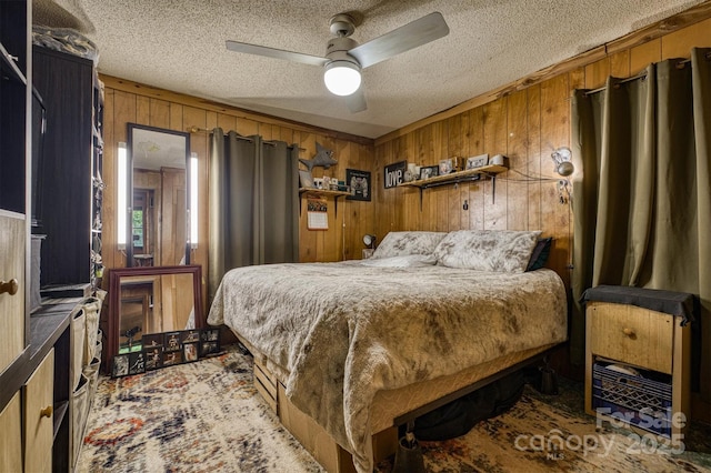 1533 Mcrary Creek Rd, Lenoir, NC 28645 - bedroom featuring a textured ceiling, wooden walls, and ceiling fan