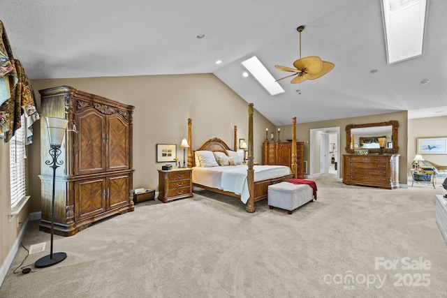 bedroom with recessed lighting, a ceiling fan, lofted ceiling with skylight, and light carpet