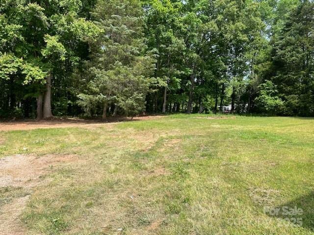 view of yard with a forest view
