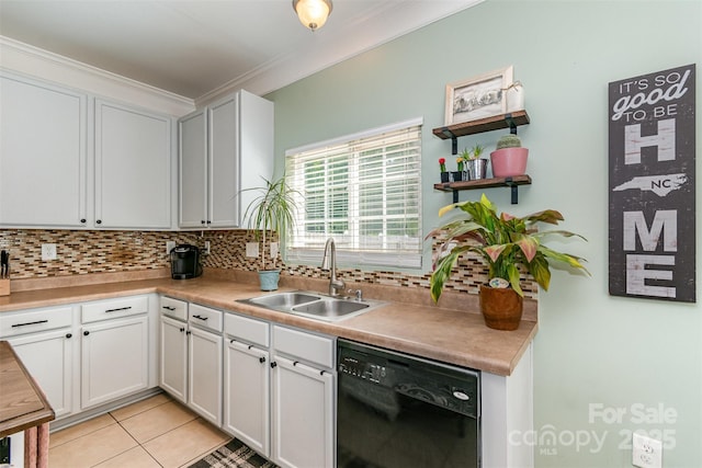 kitchen featuring ornamental molding, light tile patterned flooring, tasteful backsplash, a sink, and dishwasher