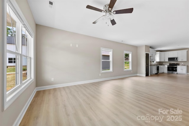 213 Benfield Rd, Kings Mountain, NC 28086 - unfurnished living room with light wood-type flooring and a ceiling fan