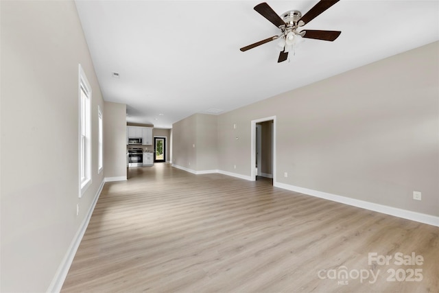 213 Benfield Rd, Kings Mountain, NC 28086 - unfurnished living room with light wood-type flooring and a ceiling fan