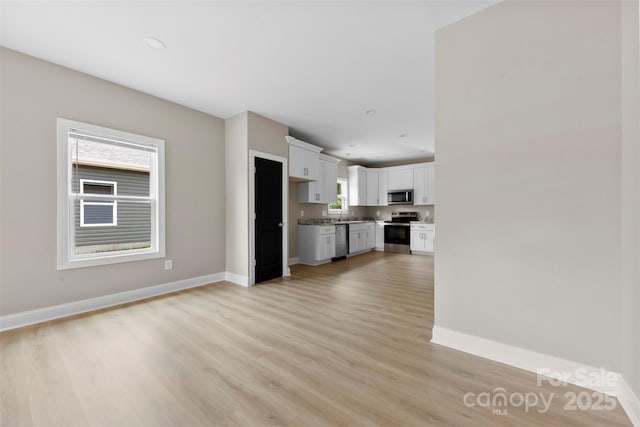 213 Benfield Rd, Kings Mountain, NC 28086 - unfurnished living room featuring light wood finished floors and recessed lighting