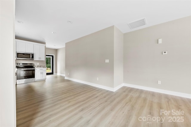 213 Benfield Rd, Kings Mountain, NC 28086 - unfurnished living room with light wood-type flooring and recessed lighting