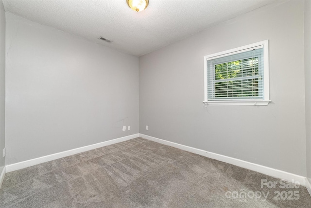 4700 Hickory Grove Rd, Mount Holly, NC 28120 - empty room featuring carpet, a textured ceiling, and baseboards