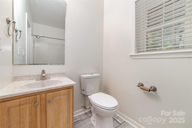 4700 Hickory Grove Rd, Mount Holly, NC 28120 - bathroom featuring toilet, vanity, and baseboards