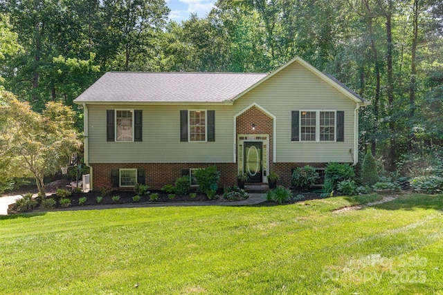 4700 Hickory Grove Rd, Mount Holly, NC 28120 - bi-level home with a front yard and brick siding