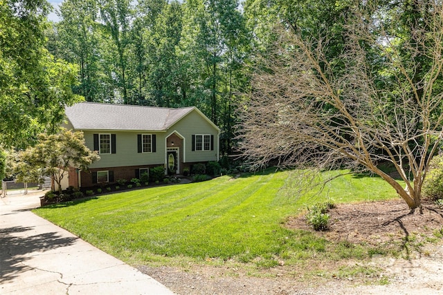 4700 Hickory Grove Rd, Mount Holly, NC 28120 - bi-level home with a front lawn, concrete driveway, and brick siding
