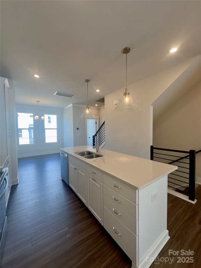 kitchen featuring stainless steel dishwasher, a sink, dark wood-type flooring, baseboards, and light countertops