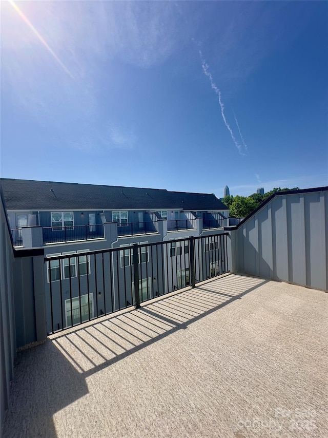 view of patio featuring a balcony