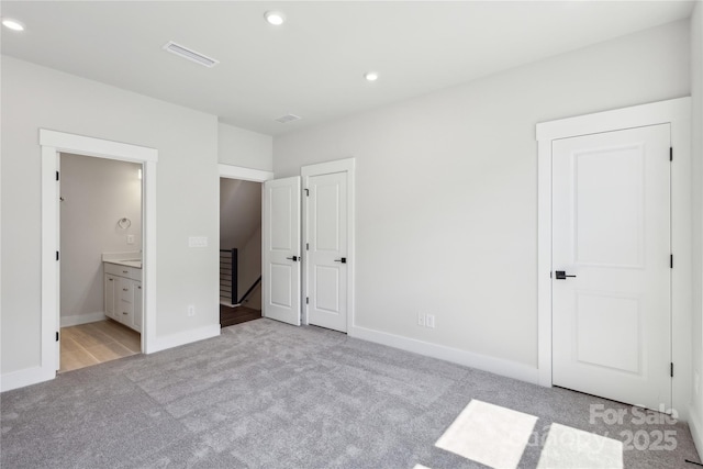2013 Clarksdale Dr Unit 38, Charlotte, NC 28206 - unfurnished bedroom featuring light carpet, recessed lighting, ensuite bath, and baseboards