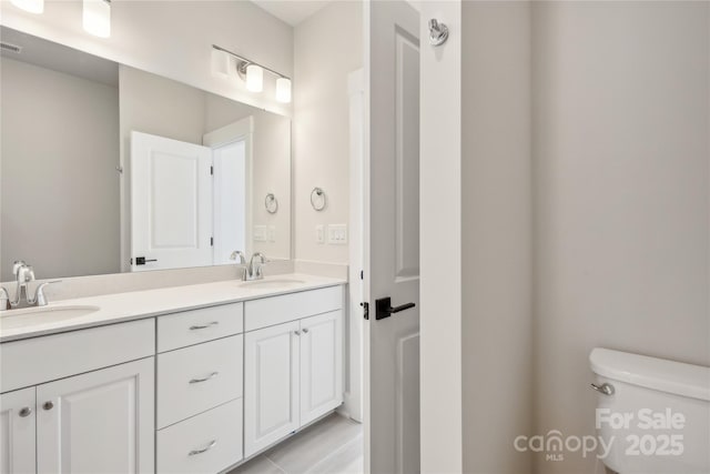 2013 Clarksdale Dr Unit 38, Charlotte, NC 28206 - bathroom with toilet and double vanity