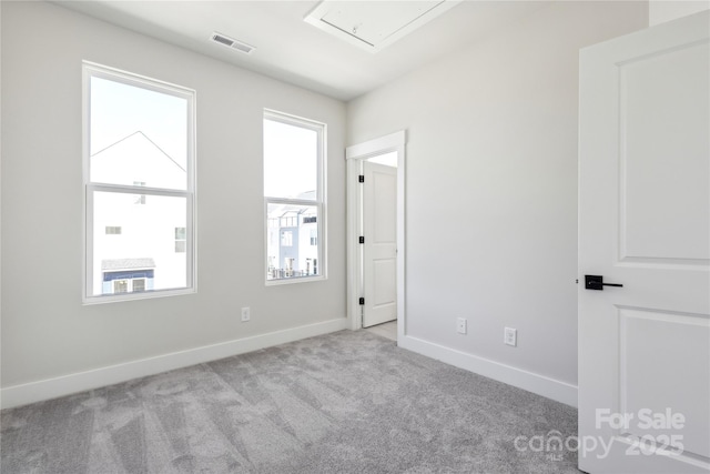 2013 Clarksdale Dr Unit 38, Charlotte, NC 28206 - spare room with carpet flooring, attic access, and baseboards