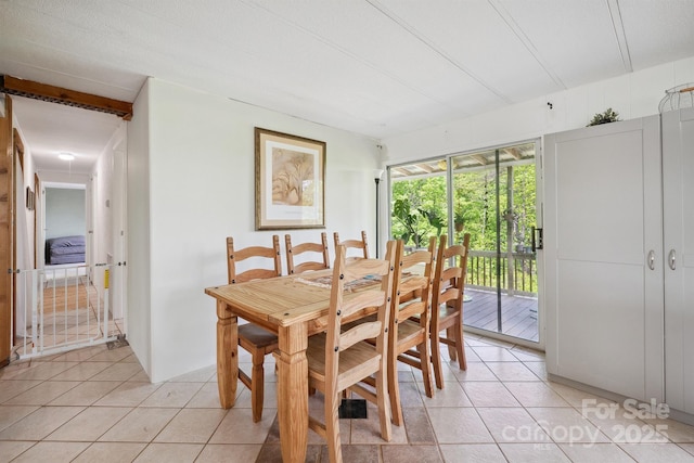 dining space with light tile patterned flooring