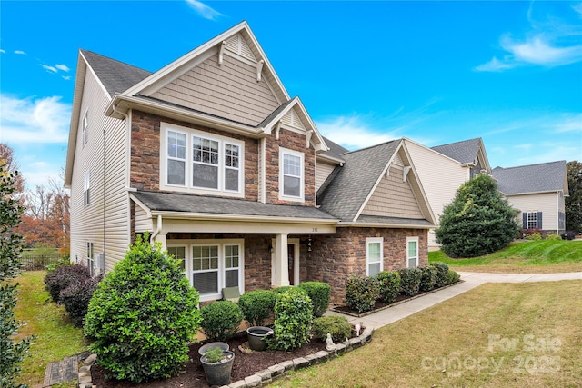 282 Fischer Rd, Fort Mill, SC 29175 - craftsman inspired home featuring stone siding, a front yard, and roof with shingles