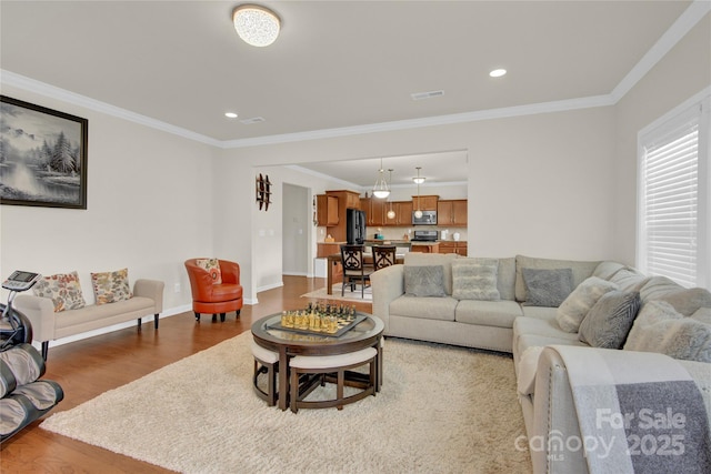 282 Fischer Rd, Fort Mill, SC 29175 - living room with wood finished floors, crown molding, recessed lighting, and baseboards