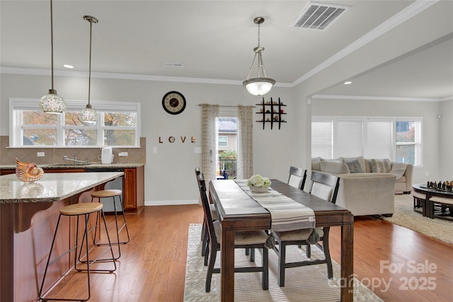 282 Fischer Rd, Fort Mill, SC 29175 - dining area featuring wood finished floors, ornamental molding, recessed lighting, and baseboards