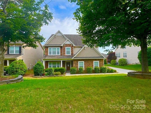 282 Fischer Rd, Fort Mill, SC 29175 - craftsman house featuring stone siding and a front lawn