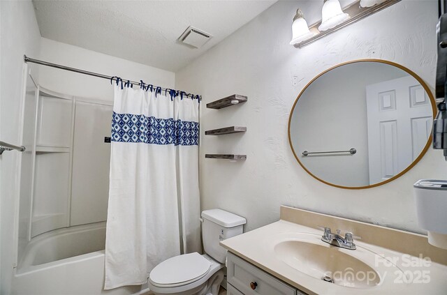 bathroom with toilet, vanity, shower / bathtub combination with curtain, and a textured ceiling