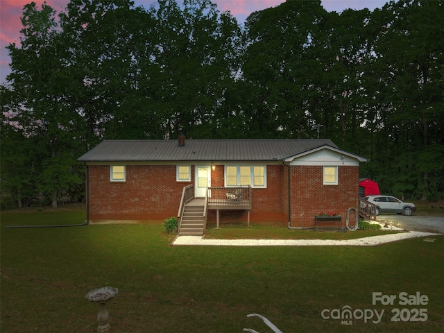 1792 Hoffman Rd, Gastonia, NC 28054 - view of front of home with a front lawn, brick siding, and metal roof