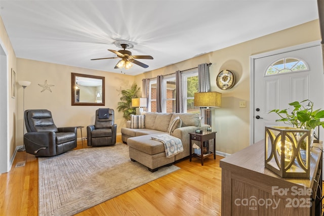 1792 Hoffman Rd, Gastonia, NC 28054 - living area with light wood finished floors, a ceiling fan, and baseboards